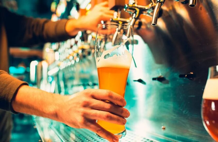 Beer being poured into a glass