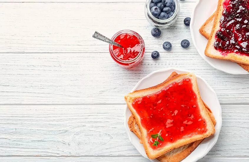 Toast spread with jam on a plate 