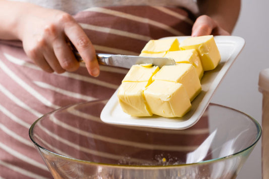 Shortening cubes being poured into a bowl