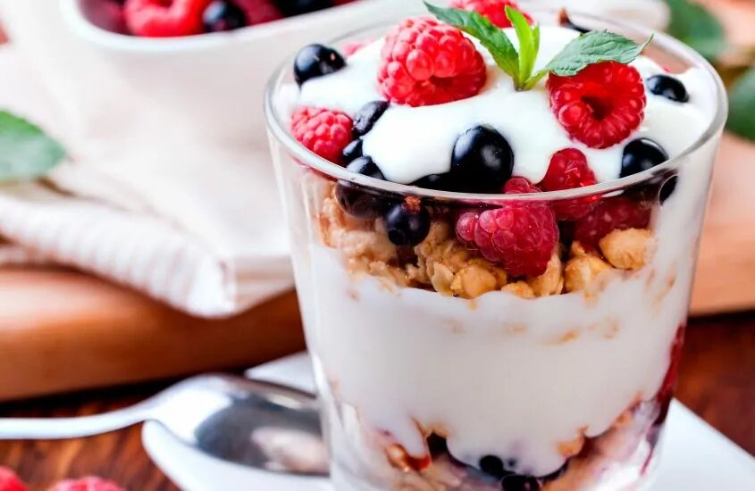cup of yogurt with fruits and granola